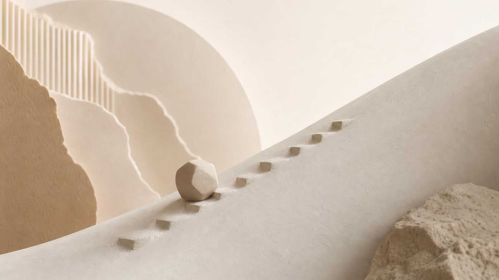 A long paper-toned path through a sparse atelier space with distant light